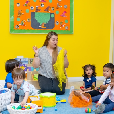 Children and teacher sitting together Photo