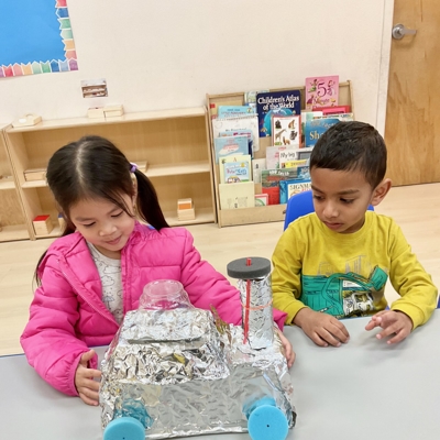 Children with foil car Photo