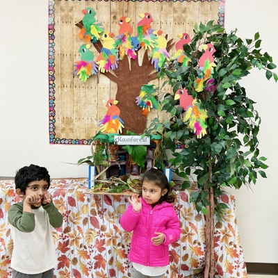 Children next to paper tree Photo
