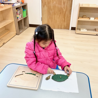 Child with art piece Photo